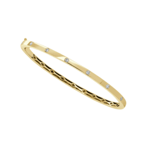 bezel set diamonds in flat bangle bracelet in yellow gold