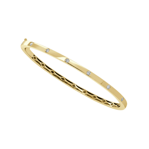 bezel set diamonds in flat bangle bracelet in yellow gold