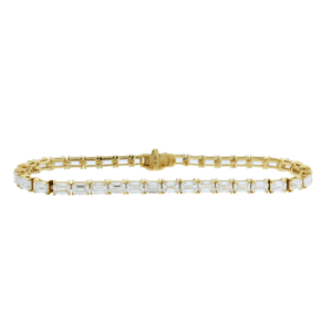 yellow gold tennis bracelet with emerald cut east to west setting