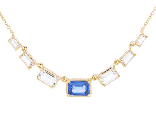 emerald cut blue sapphire in center with white topaz in yellow