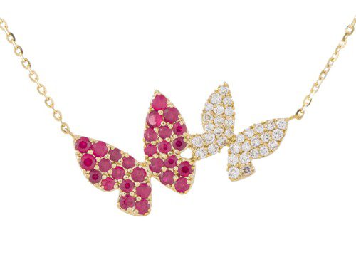 two butterfly pendants next to each other, one ruby and one diamond in yellow gold on chain