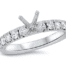 white gold diamond engagement ring with straight row of round diamonds