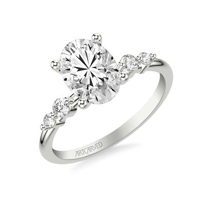 white gold diamond engagement ring with four side diamonds shared prong set, two rounds on either side of center stone