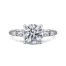 White gold diamond engagement ring with baguette diamonds on either side of center diamond