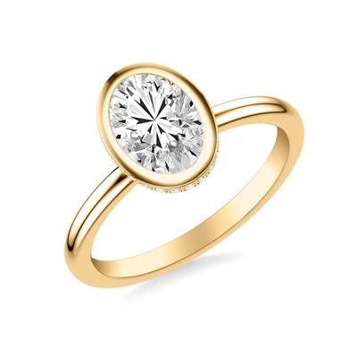 bezel set oval diamond engagement ring in yellow gold with hidden diamond halo