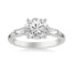 3 stone white gold diamond engagement ring with 1 tapered baguette diamond on either side of center stone