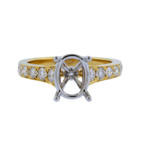 oval head diamond engagement ring with diamonds on the sides in yellow gold