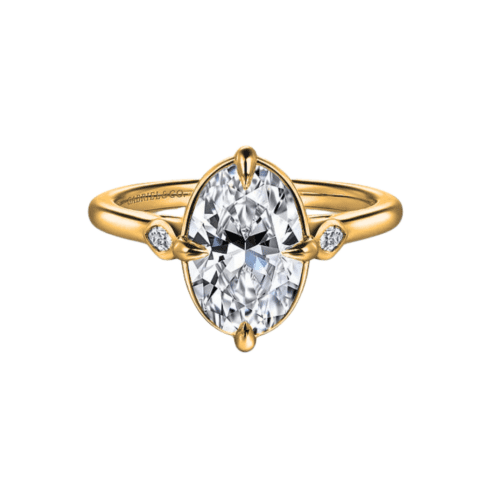 three stone engagement ring in yellow gold 4 prongs on north east south and west sides of center stone