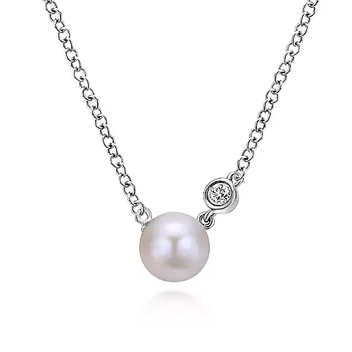 cultured white pearl on chain with small round bezel set diamond accent